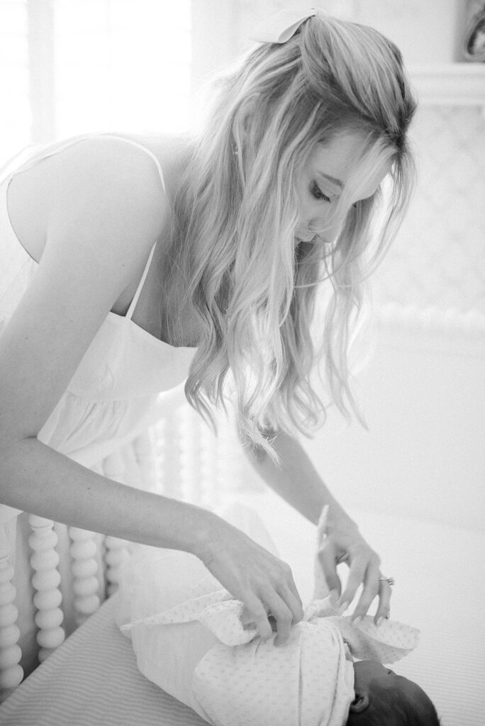 Mom and daddy holding newborn baby during newborn lifestyle photography in Indianapolis